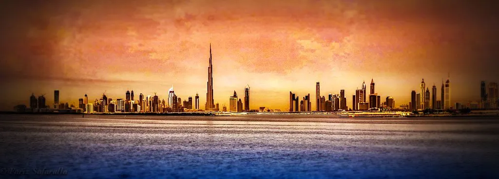 Dubai skyline at sunset across the water